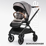 Прогулочная коляска Tomix Mirage с перекидной ручкой и умными колесами